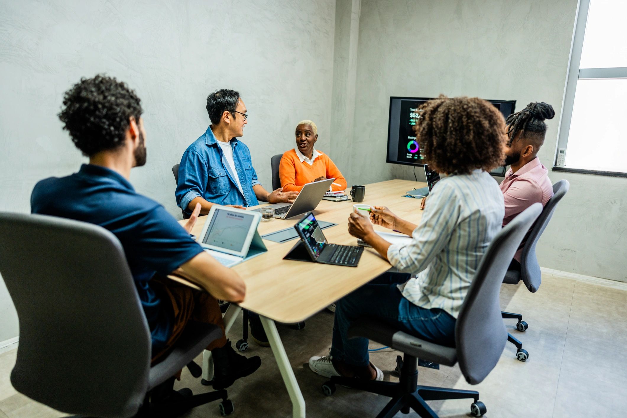 Professionals discussing enterprise software strategy in a meeting